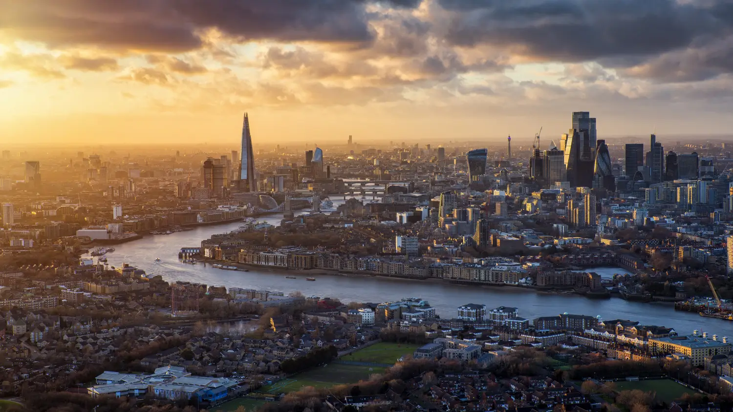 Panoramic aerial view of central London at sunset, including The Shard and City skyline, illustrating urban context for London Plan energy strategies